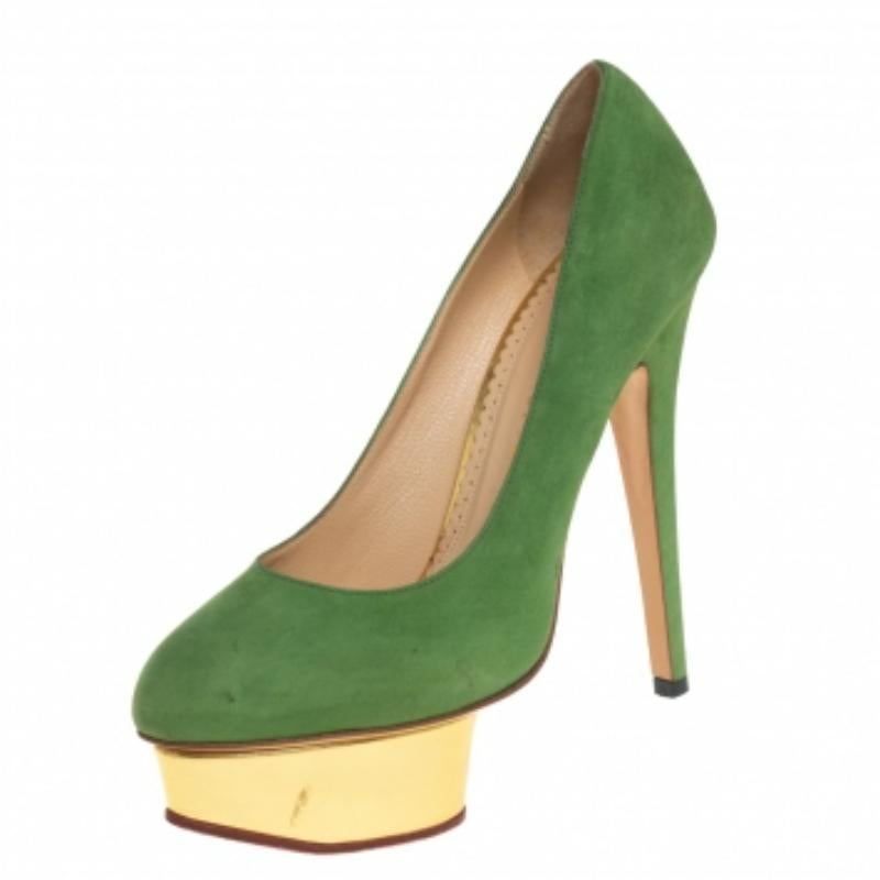 Own this meticulously designed pair of Charlotte Olympia pumps today and dazzle everyone whenever you step out! Crafted out of green suede and exhibiting almond toes, these pumps are from their Dolly collection. They are lined with leather on the