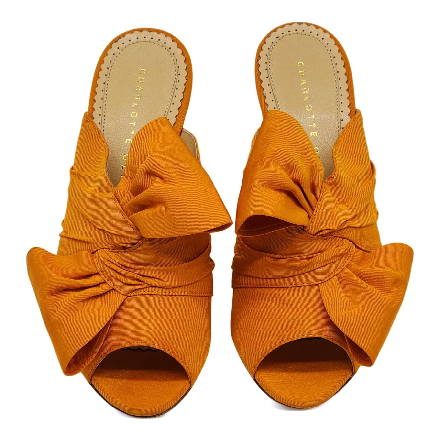 Charlotte Olympia Ilona Bow Heeled Mules Linen in Orange. Made of silk with a beautiful bow accent & Leather bottoms.

Additional information:
Material: Silk & leather
Color: Orange
Size: 36.5 (6 US)
Country: Italy
Condition: New without the box.
