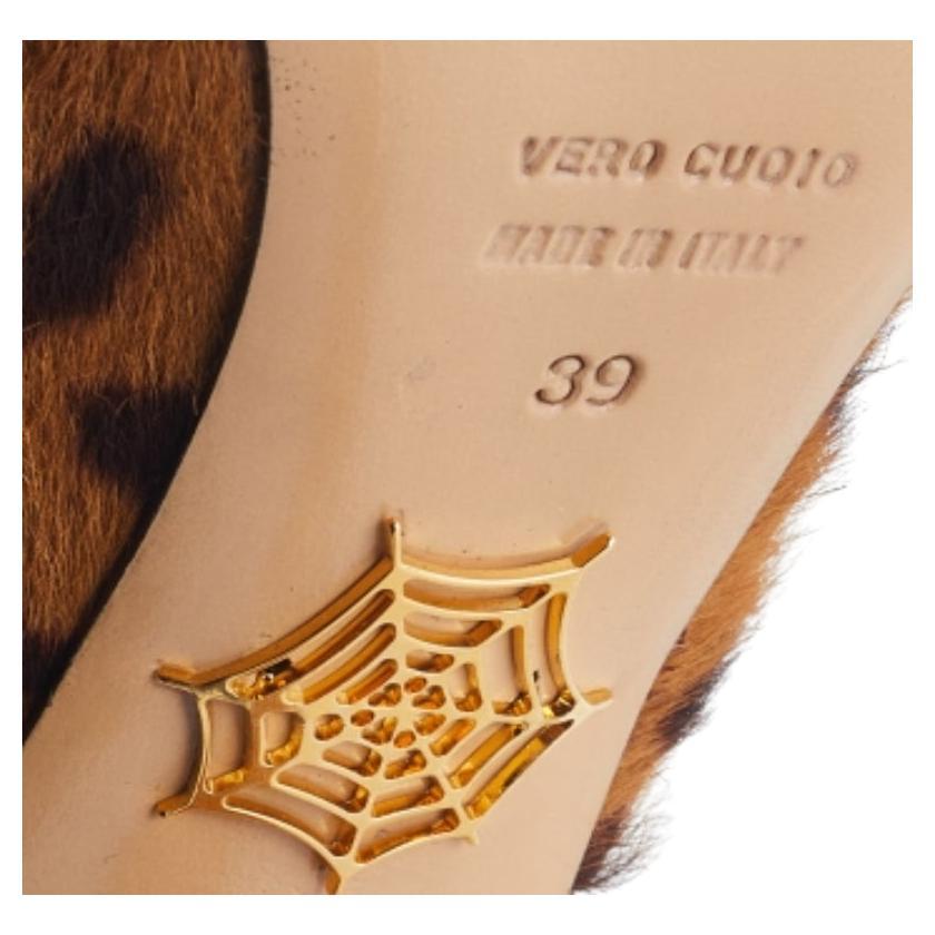 Charlotte Olympia designed these sandals in leopard print pony hair for an audaciously feminine air. Bright towering heels, slingback straps, and sturdy platforms add even more style to these chic sandals.