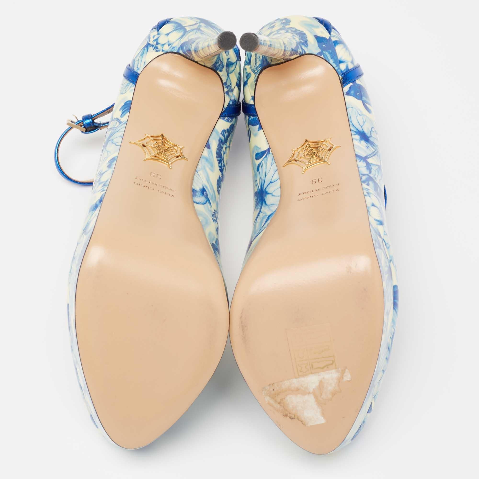 Released as part of their Shanghai Express collection, these Charlotte Olympia pumps are crafted from patent leather and designed with 'Koi Carp' prints. The beautiful shoes are balanced on platforms and slim heels.

Includes: Original Box