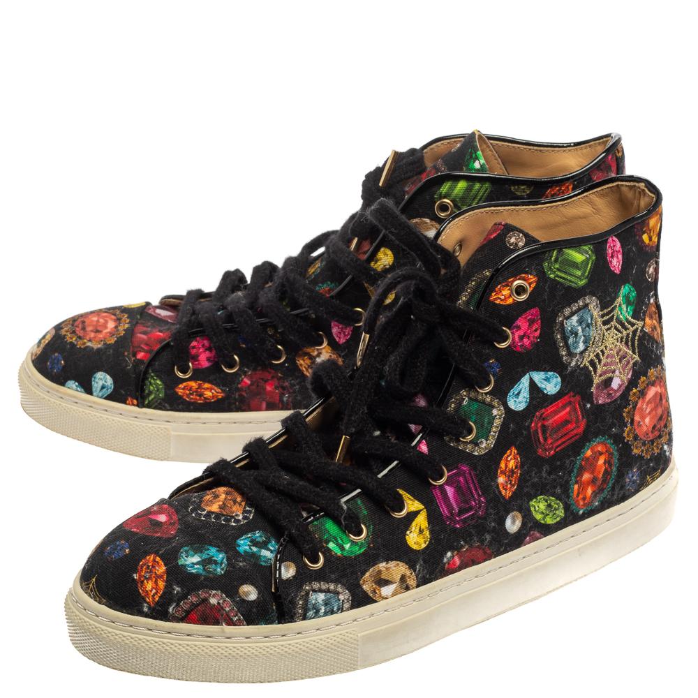 You're sure to win hearts with these high-top sneakers from Charlotte Olympia! Crafted from quality canvas, the trendy shoes carry a multicolor jewel print all over and come with round toes and lace-ups on the vamps. They are sure to lend one the