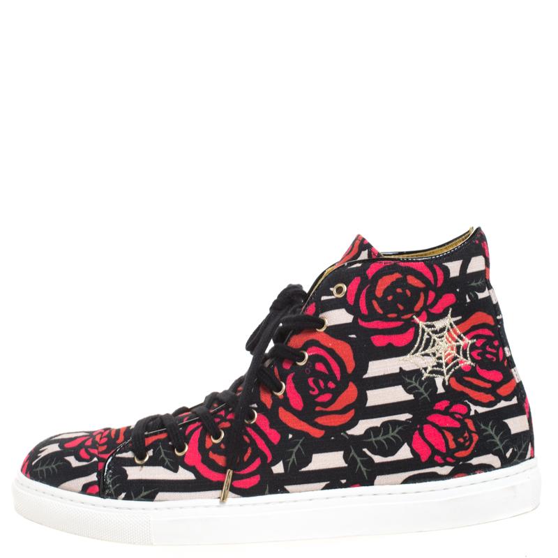 This unique pair of sneakers from Charlotte Olympia is all you need to express your playful style. Crafted from quality canvas, they flaunt a multicolored rose print throughout. They are styled with lace-up fronts, platforms, 2 cm heels, silver-tone