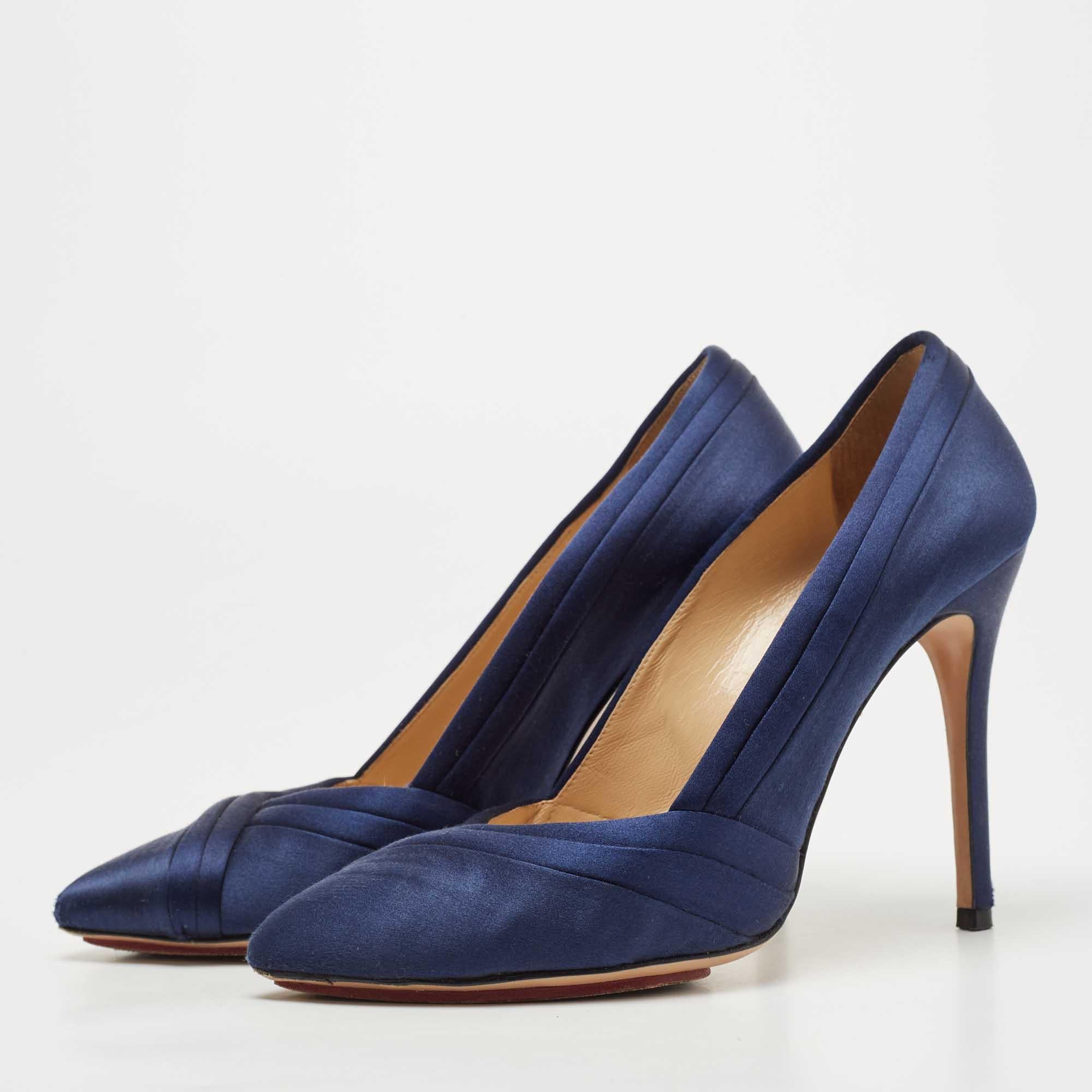 Beautiful and fabulous  this pair of Charlotte Olympia pumps will take you to new levels. Made from satin  their smooth exterior has just the right amount of shine  colored with a navy blue shade. The platforms and 12cm heels finish them off