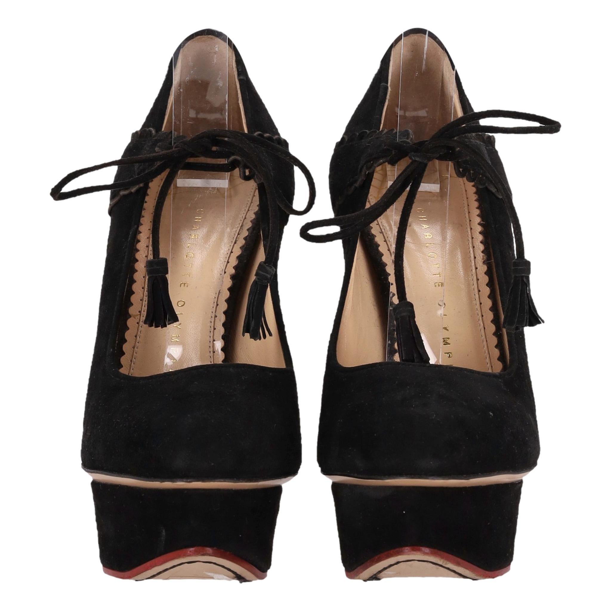 Charlotte Olympia Ophelia Suede Platform Heels

Black platform pumps crafted form suede, detailed with scalloped strap with tassel tie-up closure to the vamp.

Featuring almond toe and high, stiletto heel.

Rrp Approx. £750

Size – 38

Condition –