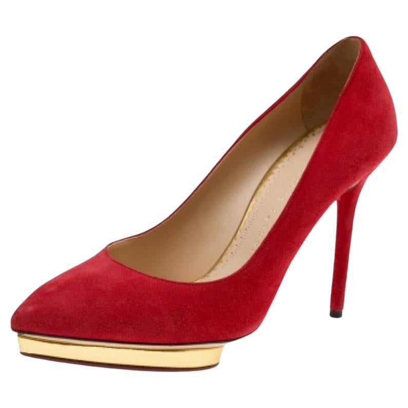 These meticulously crafted pumps from Charlotte Olympia are definitely something you should own as a fashionista. Made out of suede in a classy shade of orange, these pumps rest on elevated platforms and come with 11 cm stiletto heels to give your