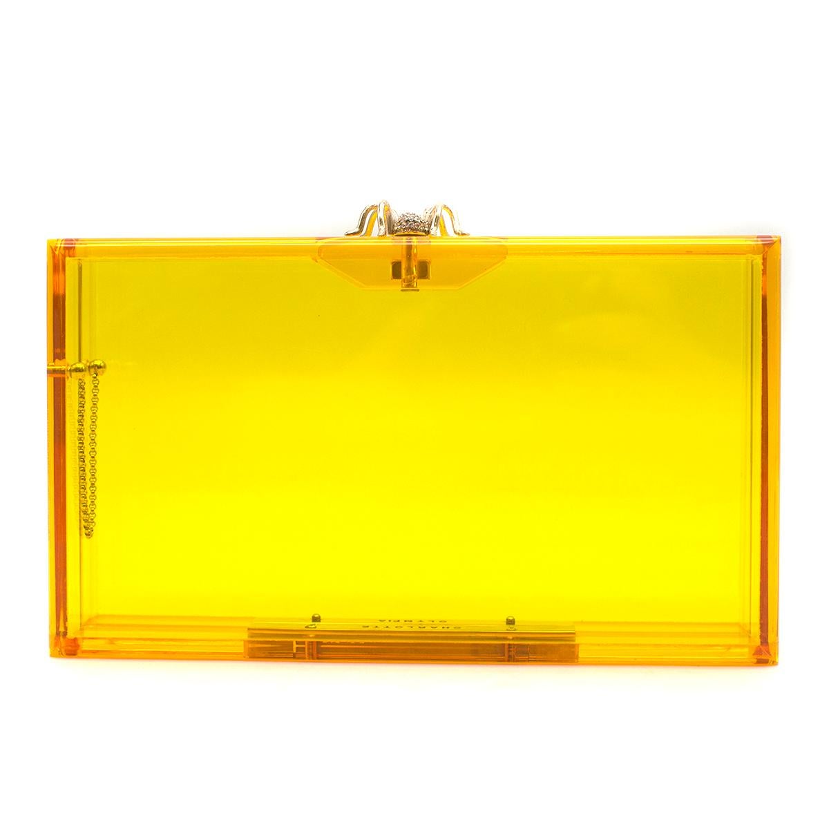 Charlotte Olympia Perspex Pandora Clutch

- Golden yellow perspex Pandora clutch
- Gold-tone and Swarovski crystal spider clasp
- Golden metallic sparkly zipped pouch for essentials 
- Boxed with dust bag
- Perfect gift

Please note, these items are