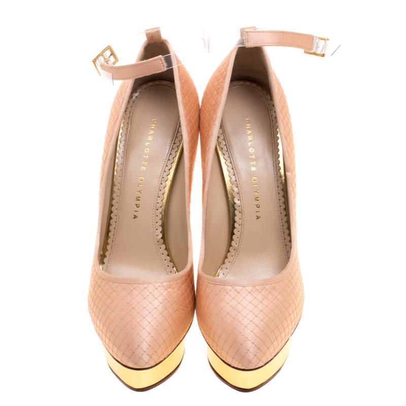 Expect ultra-feminine styles and old Hollywood charm from a typical Charlotte Olympia collection. These Dolores pumps are set on gold-tone platform sole and feature slim heels. Featuring a peach quilted satin body, this pair comes with an almond toe