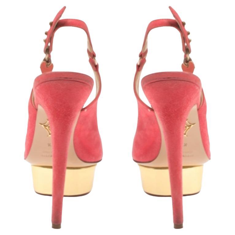 Own this meticulously designed pair of Charlotte Olympia pumps today and dazzle everyone whenever you step out! Crafted out of pink suede and lined with leather on the insoles, this creation features a peep-toe silhouette. They have been beautified