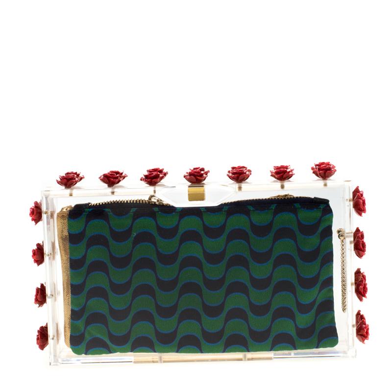 If you are someone who has a love for things that are edgy and unique, then this Pandora Box Clutch by Charlotte Olympia is perfect for you. Crafted from clear Plexiglass and styled with roses on the edges, the clutch is accompanied by two different