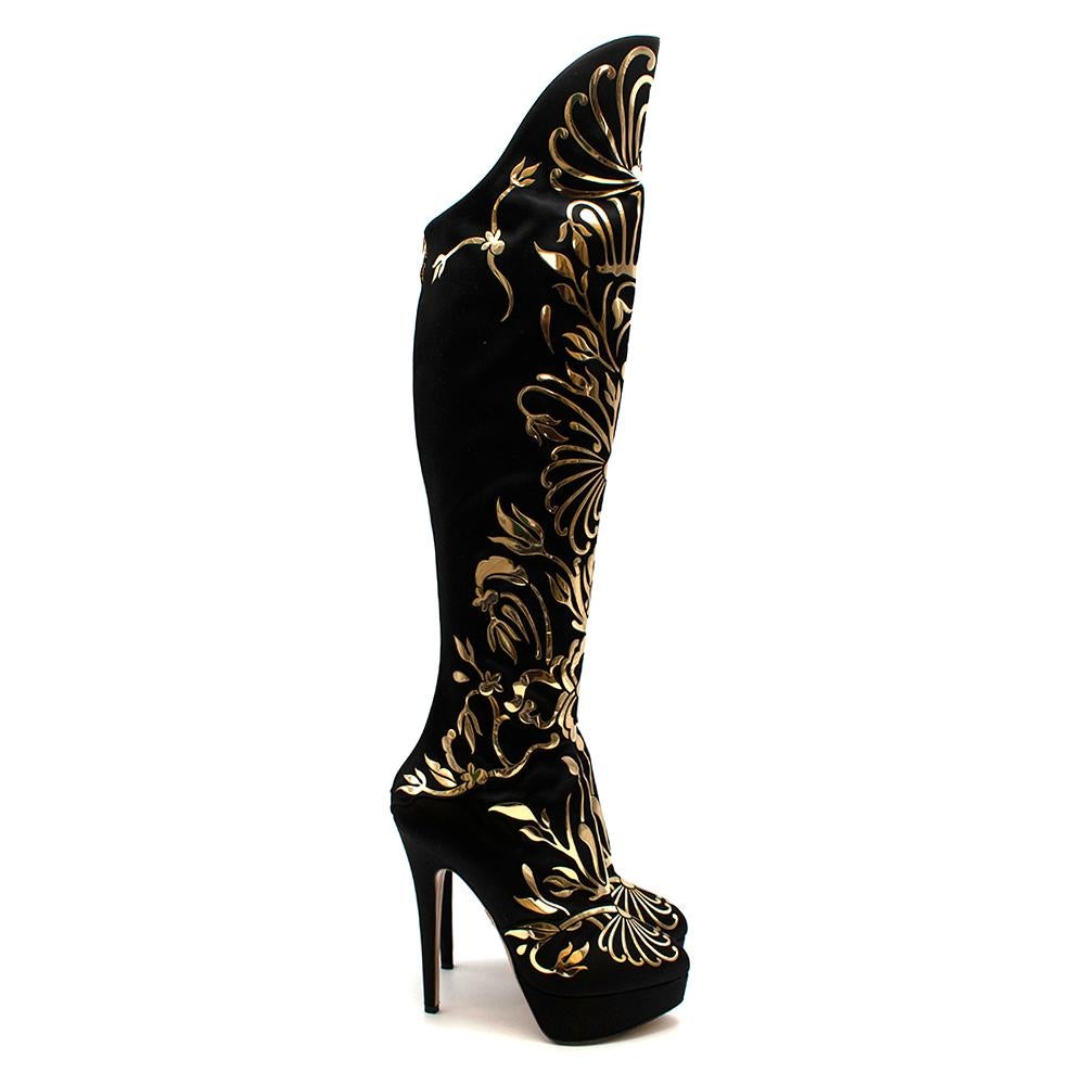Charlotte Olympia Prosperity Black & Gold Knee High Boots
-Shining gold detailing throughout
-Zipper all the way down back
-High heel platform boot
-Round toes
-Tonal stitching
-Over-the-knee design

Materials: -Silk satin upper
-Calfskin leather