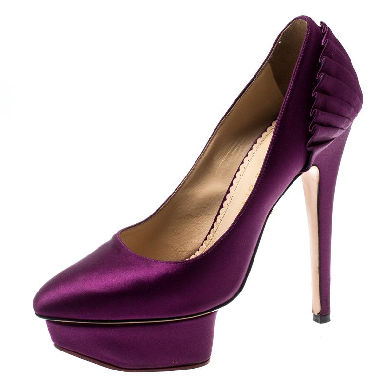 Jazz up your everyday attire with this pair of classic pumps, designed by Charlotte Olympia. Crafted from satin, these are styled with platforms, high heels and fan pleat detail at the counters. This pair of purple beauties combines glamorous style