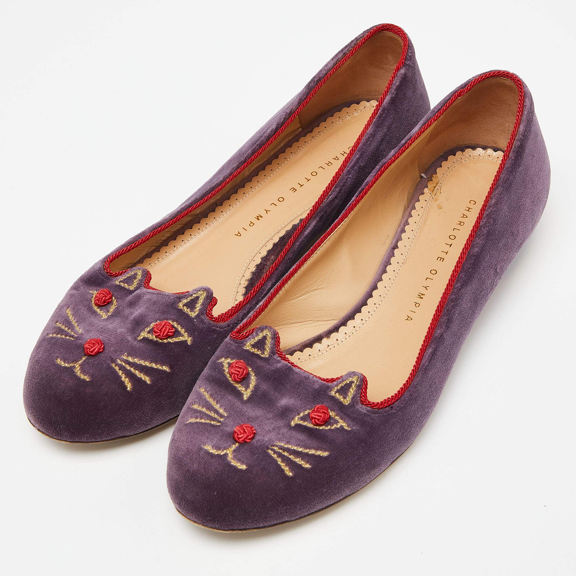 Adorn your feet with these pretty flats from Charlotte Olympia's Emoticats collection. They come crafted from purple velvet and styled with cheeky kitty face embroidery and low heels sized to provide comfort at every step. Flaunt these cute flats