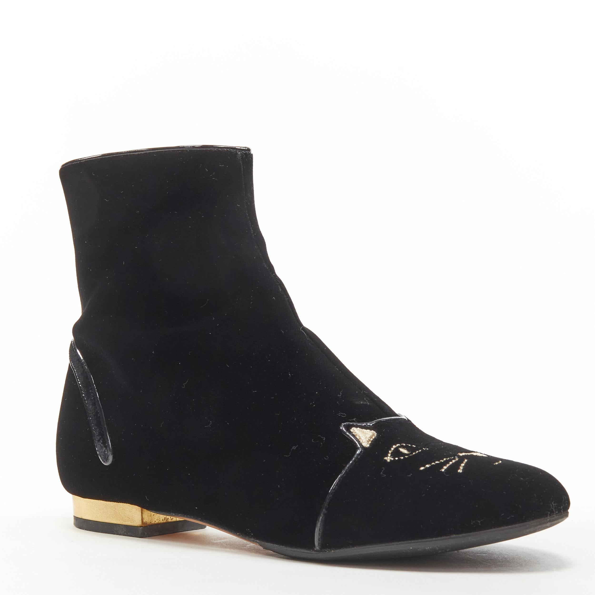 CHARLOTTE OLYMPIA Puss In Boots black velvet Kitty embroidery ankle boot EU36.5 
Reference: ANWU/A00174 
Brand: Charlotte Olympia 
Material: Velvet 
Color: Black 
Pattern: Solid 
Closure: Zip 
Extra Detail: Gold leather wrapped heel. 
Made in: Italy