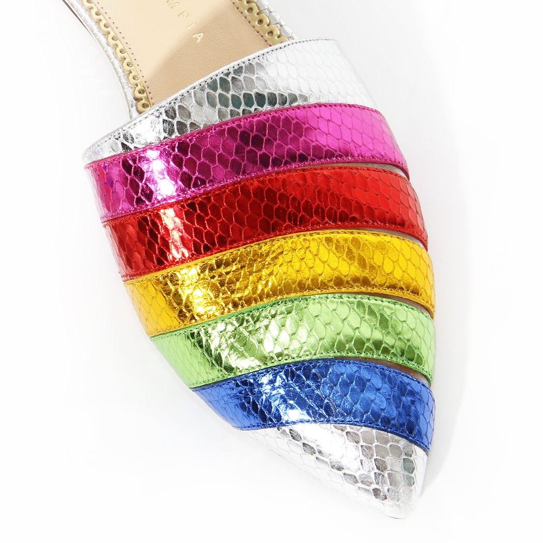 Rainbow slides by Charlotte Olympia 
Rainbow metallic leather
Faux snake print 
Pointed toe 
Clear cutouts 
Slip-on 
Pointed toe 
Made in Italy
Dust bag included
Condition: Great, scuffing on soles. light markings on the insole. (see photos)