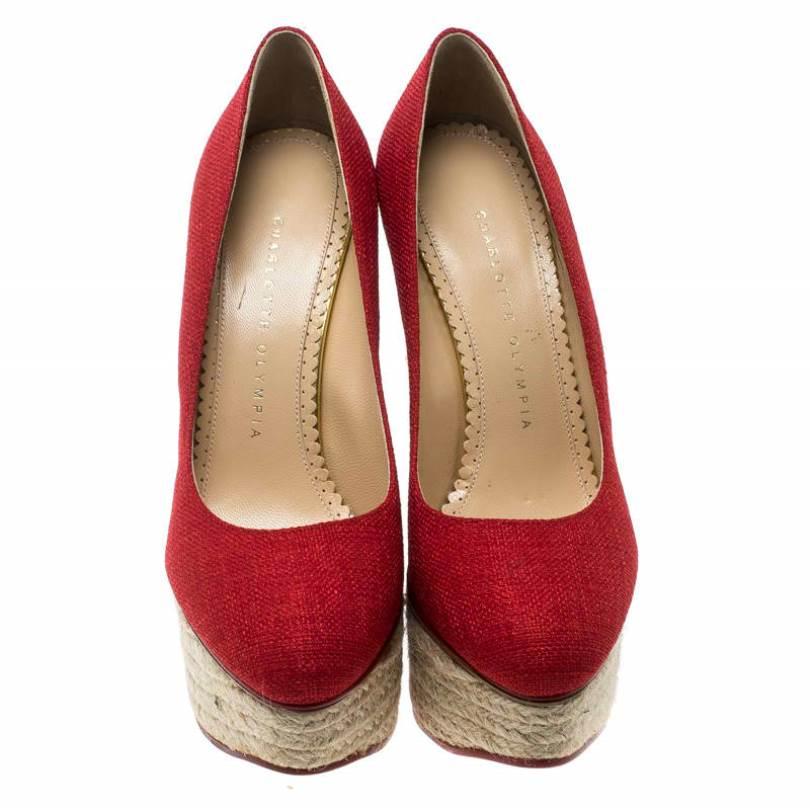 Well, isn't this Charlotte Olympia pair simply stunning! The pumps have been designed so beautifully with red canvas that they make one's heart flutter. They come in a simple design of espadrille platform wedges which gives the pair full marks on