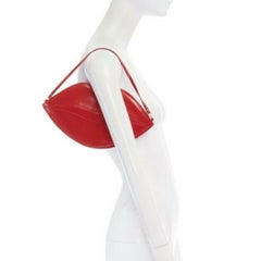 CHARLOTTE OLYMPIA red leather lip top handle flat pouch clutch bag