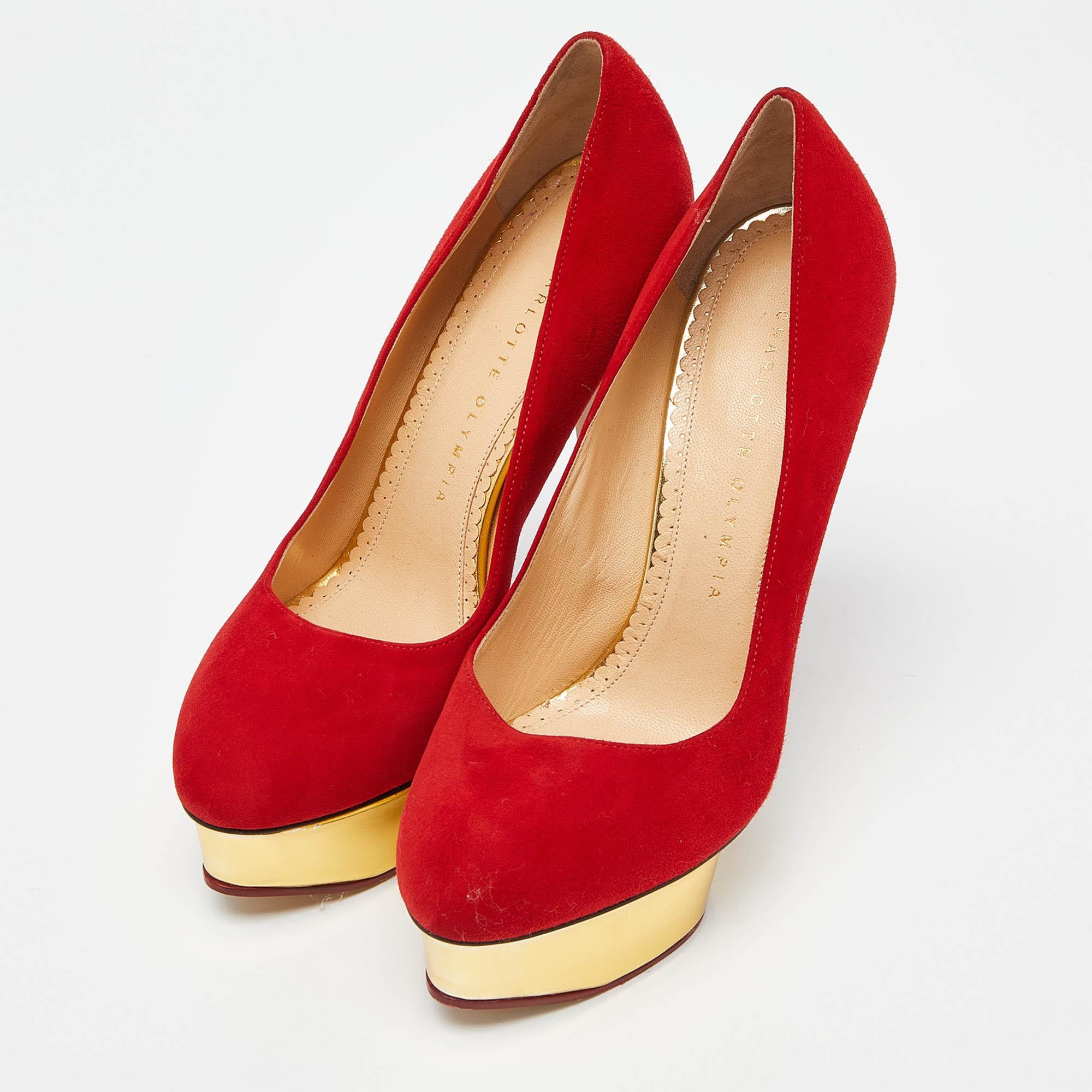 Own this meticulously designed pair of Charlotte Olympia pumps today and dazzle everyone whenever you step out! Crafted out of suede, this creation is from their Dolly collection. They have been beautified with 14.5cm heels and platforms.