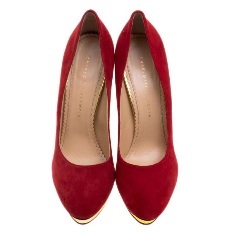 Own this meticulously designed pair of Charlotte Olympia pumps today and dazzle everyone whenever you step out! Crafted out of suede in a heart-skipping red shade and lined with leather on the insoles, this number is from their Dotty collection.