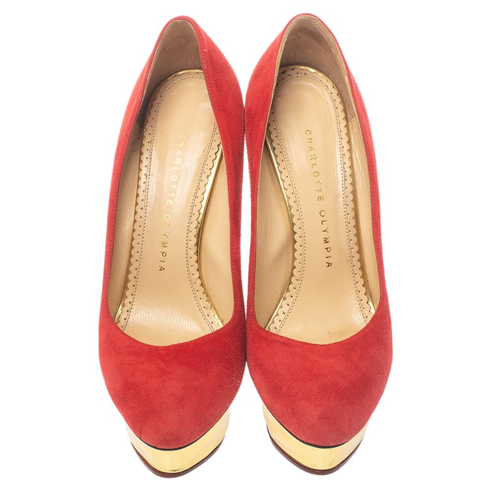 You are sure to impress everyone whenever you step out in these pumps from Charlotte Olympia! Crafted out of suede in an enticing red shade and lined with leather on the insoles, this number is from their Dolly collection. They've been beautified