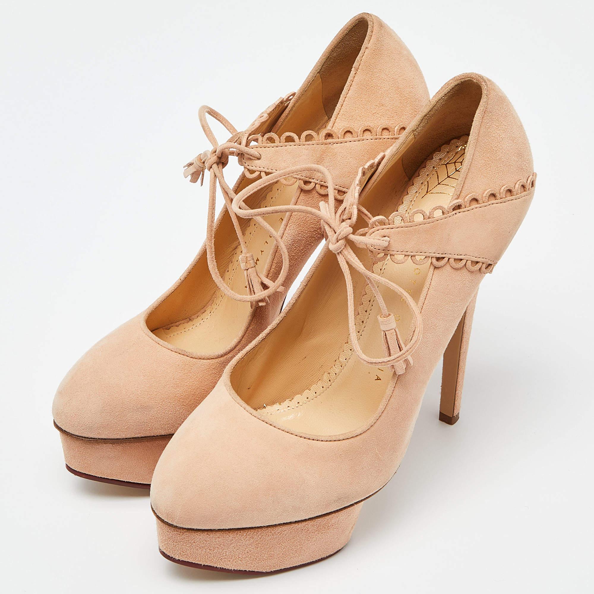 Own this meticulously designed pair of Charlotte Olympia pumps today and dazzle everyone whenever you step out Crafted out of suede in a dreamy salmon hue and lined with leather on the insoles this number is from their Dolly collection. Theyve been