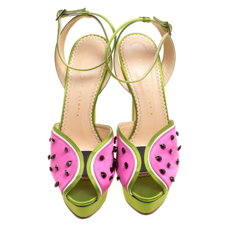 Introduce your shoe closet to an addition as magnificent as this pair of sandals from Charlotte Olympia! The sandals have been artistically crafted from satin and the uppers are designed to resemble watermelons with the help of black crystals to