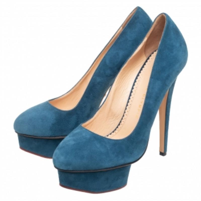 Own this meticulously designed pair of Charlotte Olympia pumps today and dazzle everyone whenever you step out! Crafted out of suede and lined with leather on the insoles, this creation is from their Dolly collection. They have been beautified with