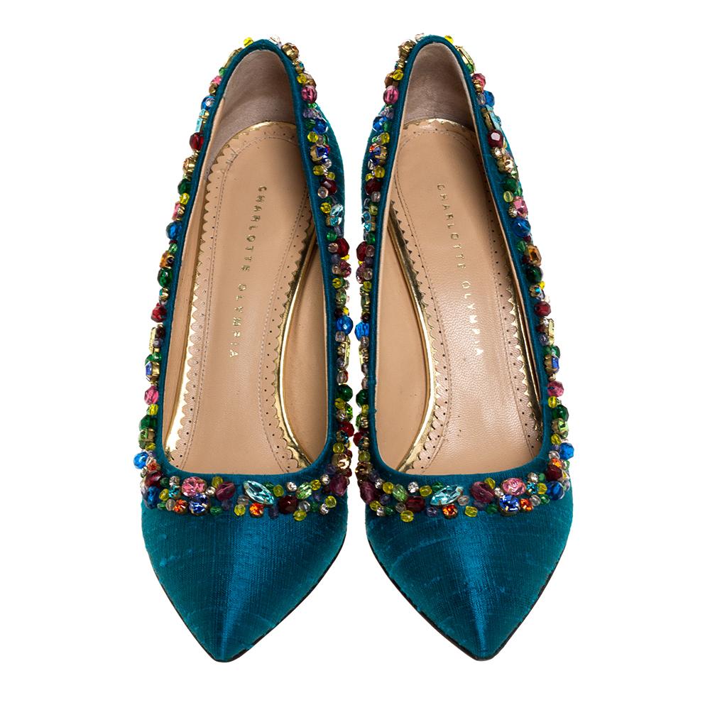 Featuring a chic design, these pumps from Charlotte Olympia are easy to style. Teal silk uppers showcase pretty crystal embellishments. Stiletto heels and pointed toes form a distinctive outline. Their feminine design pairs well with your evening