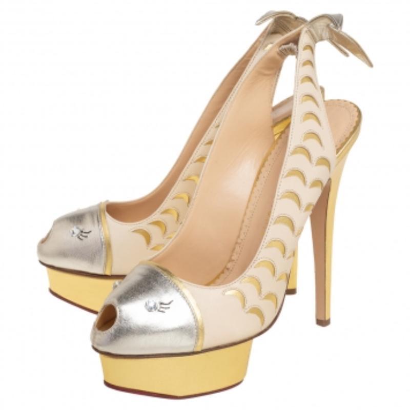 Conosciuta per l'aggiunta di design stravaganti nelle sue creazioni, la In-House Design di Charlotte Olympia ci offre ancora una volta uno stile accattivante. Questi sandali Seaside sono realizzati in pelle tricolore con accenti e dettagli cut-out
