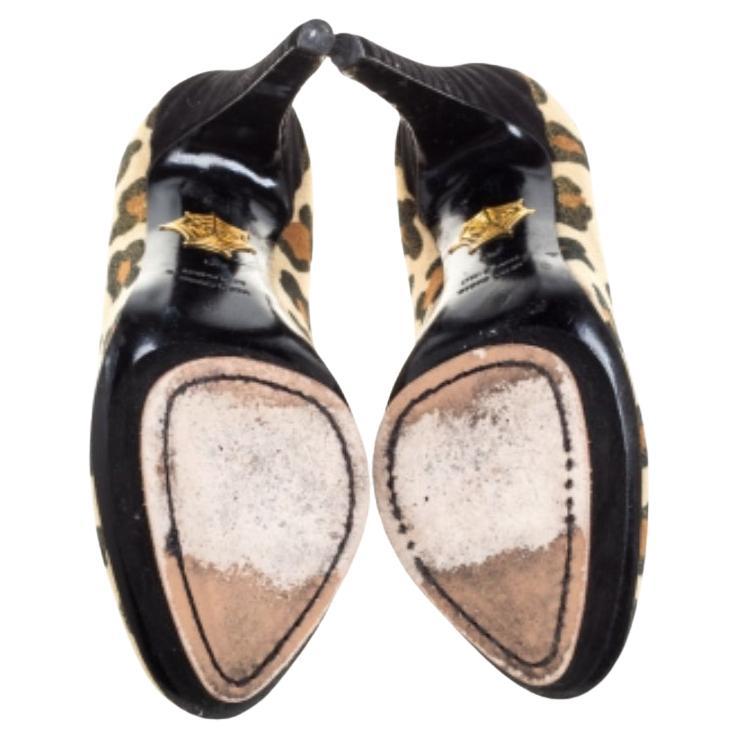 These magnificent pumps from Charlotte Olympia are set on solid platforms and 14.5 cm heels. They have been crafted from leopard printed glitter and suede and styled with almond toes. They are endowed with comfortable leather-lined insoles and will