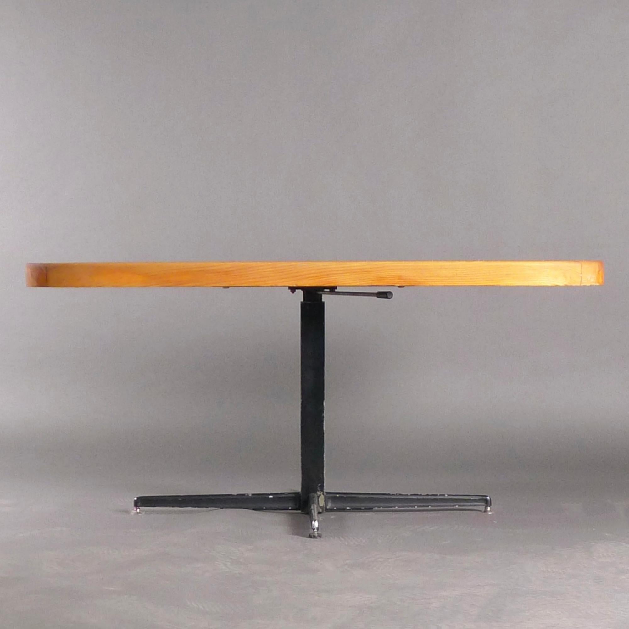 A rare adjustable dining / coffee table, designed by Charlotte Perriand for use in the series of ski resorts she worked on in Les Arcs, France, during the 1960s-70s.

The rounded corners of the planked pine top were designed to prevent injury in the
