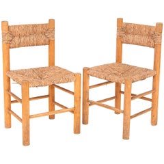 Charlotte Perriand Attributed Pair of Chairs, circa 1950, in Wood and Rush