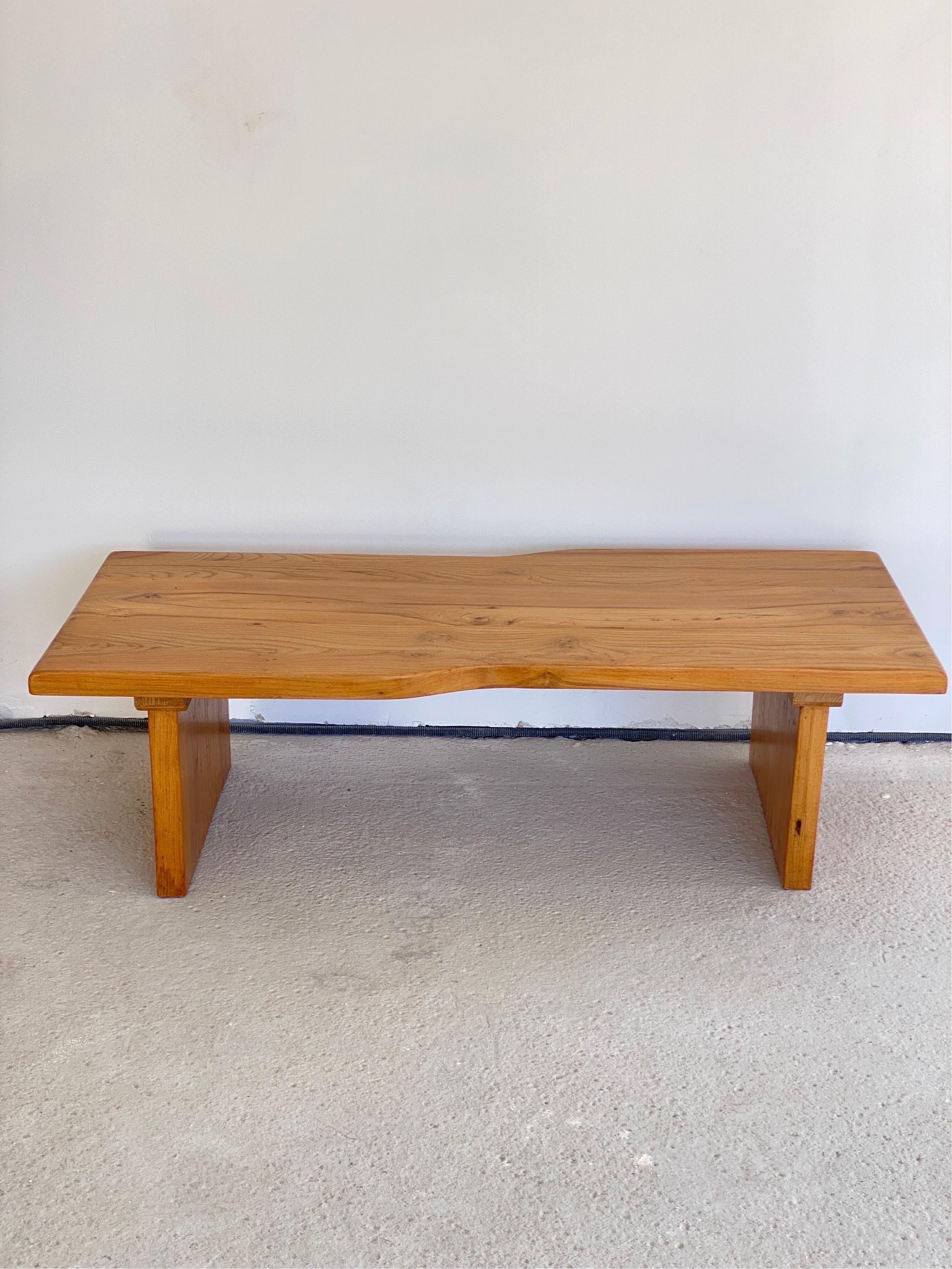 Solid Elm coffee table, in the style Charlotte Perriand or Pierre Chapo, France, c. Mid-20th Century. 

Amazing high quality workmanship.

A thick top with the concave edge and plinth feet, are assembled by tongues and grooves technique. typical of