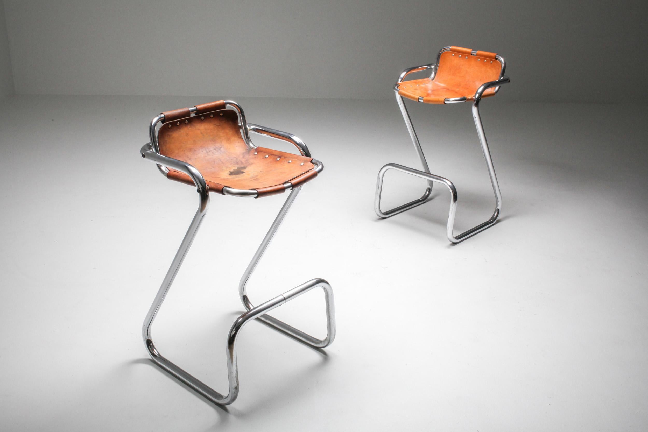 Cognac leather, tubular chrome, attributed to Charlotte Perriand, France, 1960s

Superb set of five barstools with incredible patina on the seats.
 