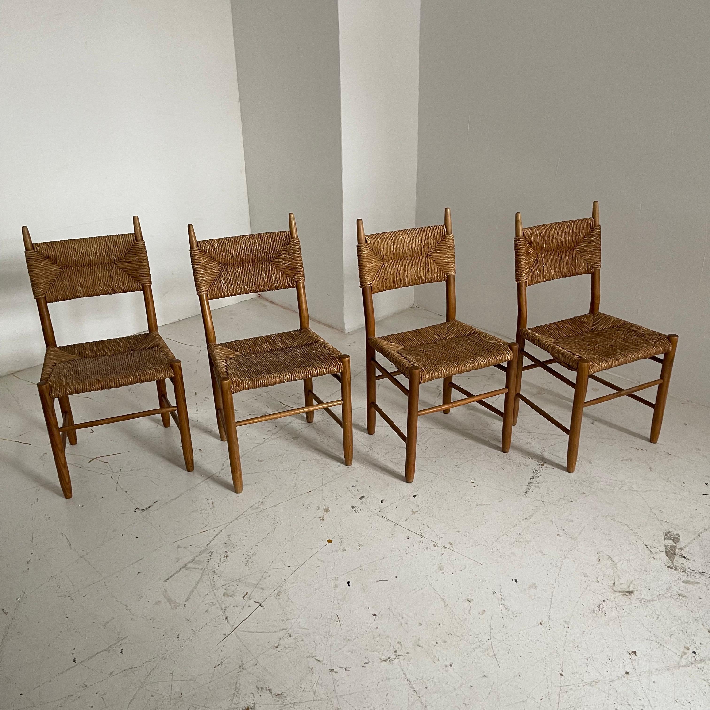 In the style of Charlotte Perriand Bauche No. 19 chairs for BCB, set of four, France 1955.