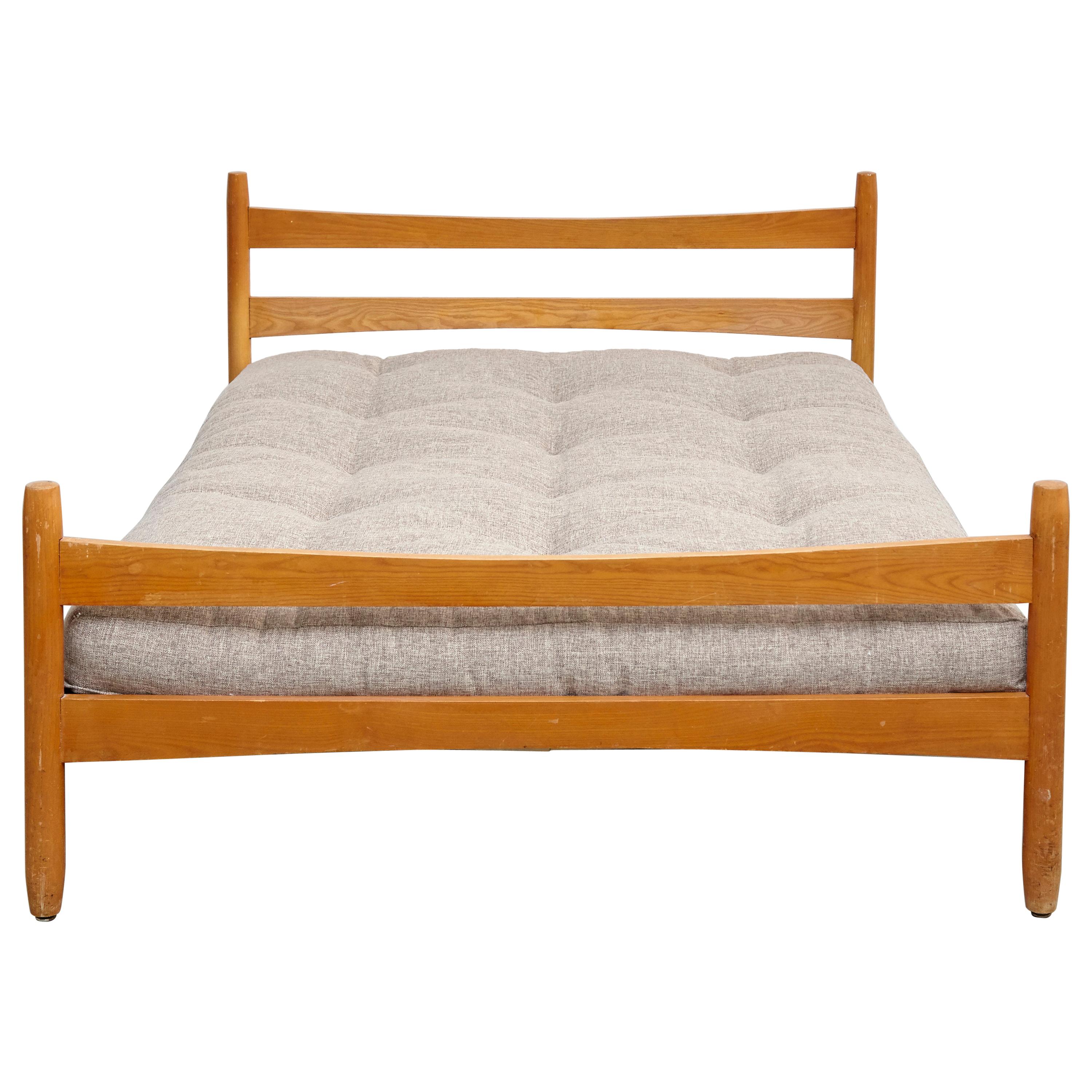 Bed designed by Charlotte Perriand for Meribel, circa 1960.
Manufactured in France.

Pinewood.

In good original condition, with minor wear consistent with age and use, preserving a beautiful patina.

Charlotte Perriand (1903-1999). She was