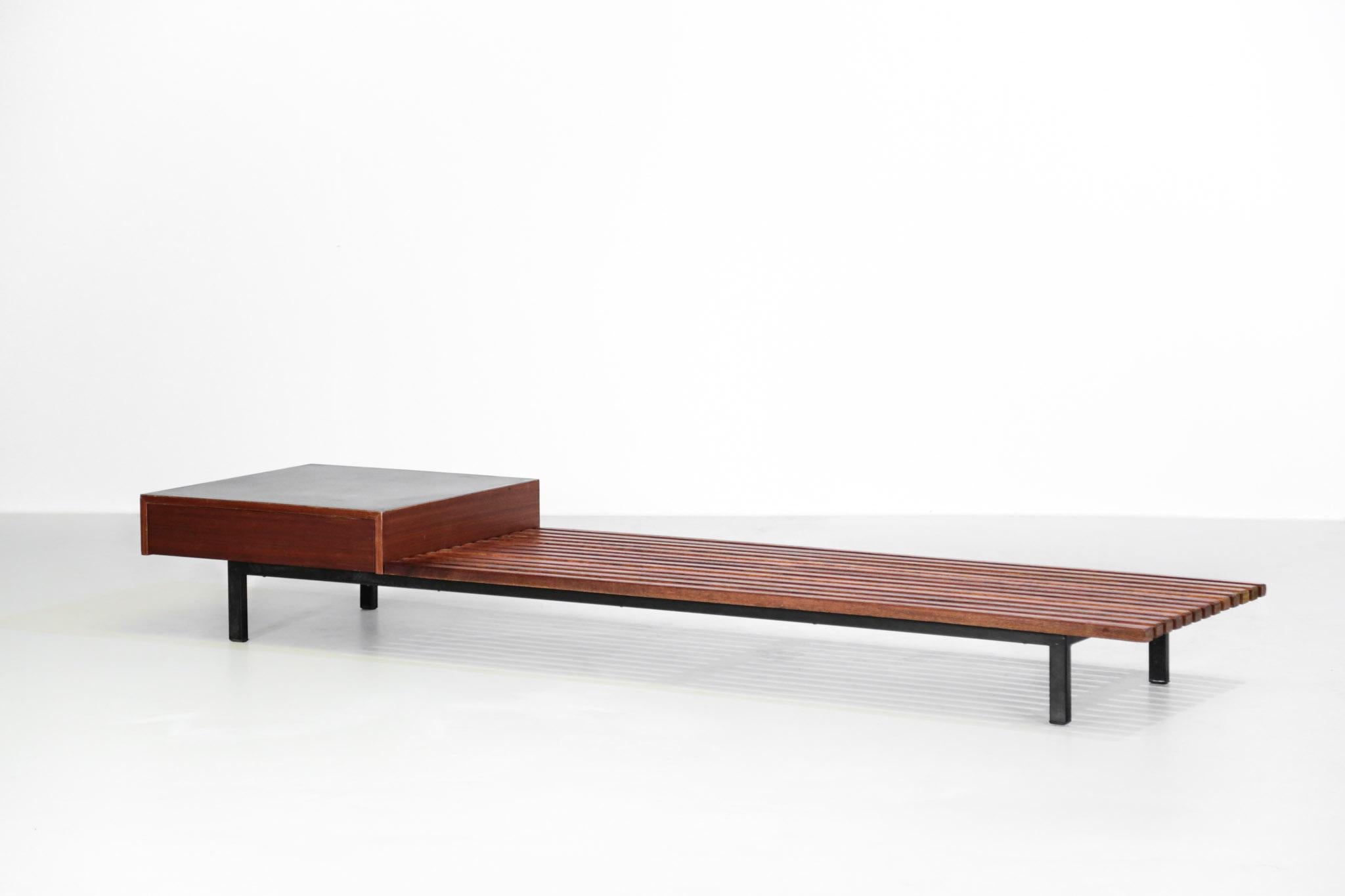 Rare bench with one drawer designed by Charlotte Perriand 
Drawer in mahogany wood and plastic laminated, frame in lacquered metal, top of oak.
 