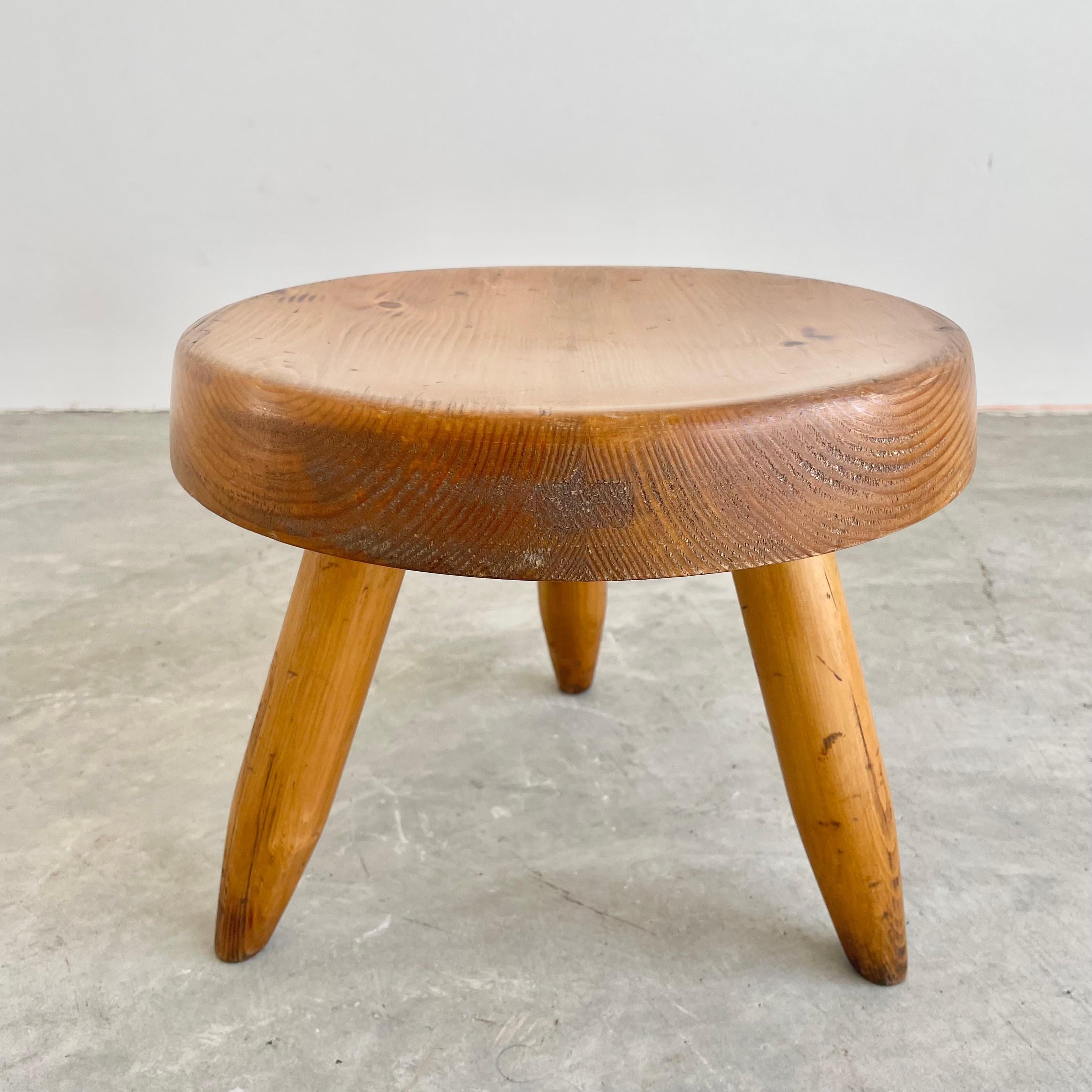 Collectible Berger stool by Charlotte Perriand. Circa 1950s. This french oak stool is in good condition, with slight wear and excellent patina. You can find this stool featured in the Charlotte Perriand complete works Volume 2.