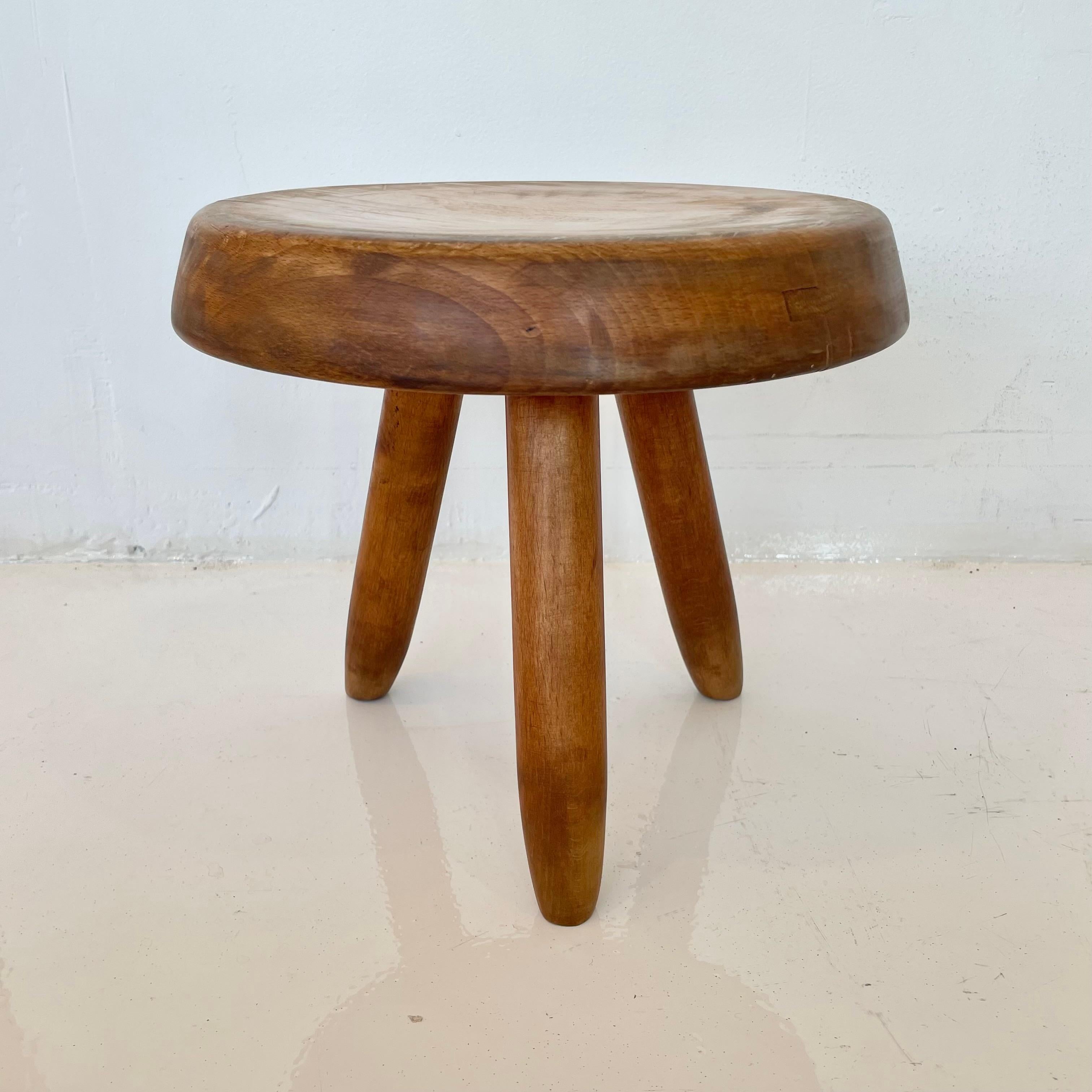 Collectible Berger stool by Charlotte Perriand. Circa 1950s. This french oak stool is in good condition, with slight wear and excellent patina. You can find this stool featured in the Charlotte Perriand complete works Volume 2.