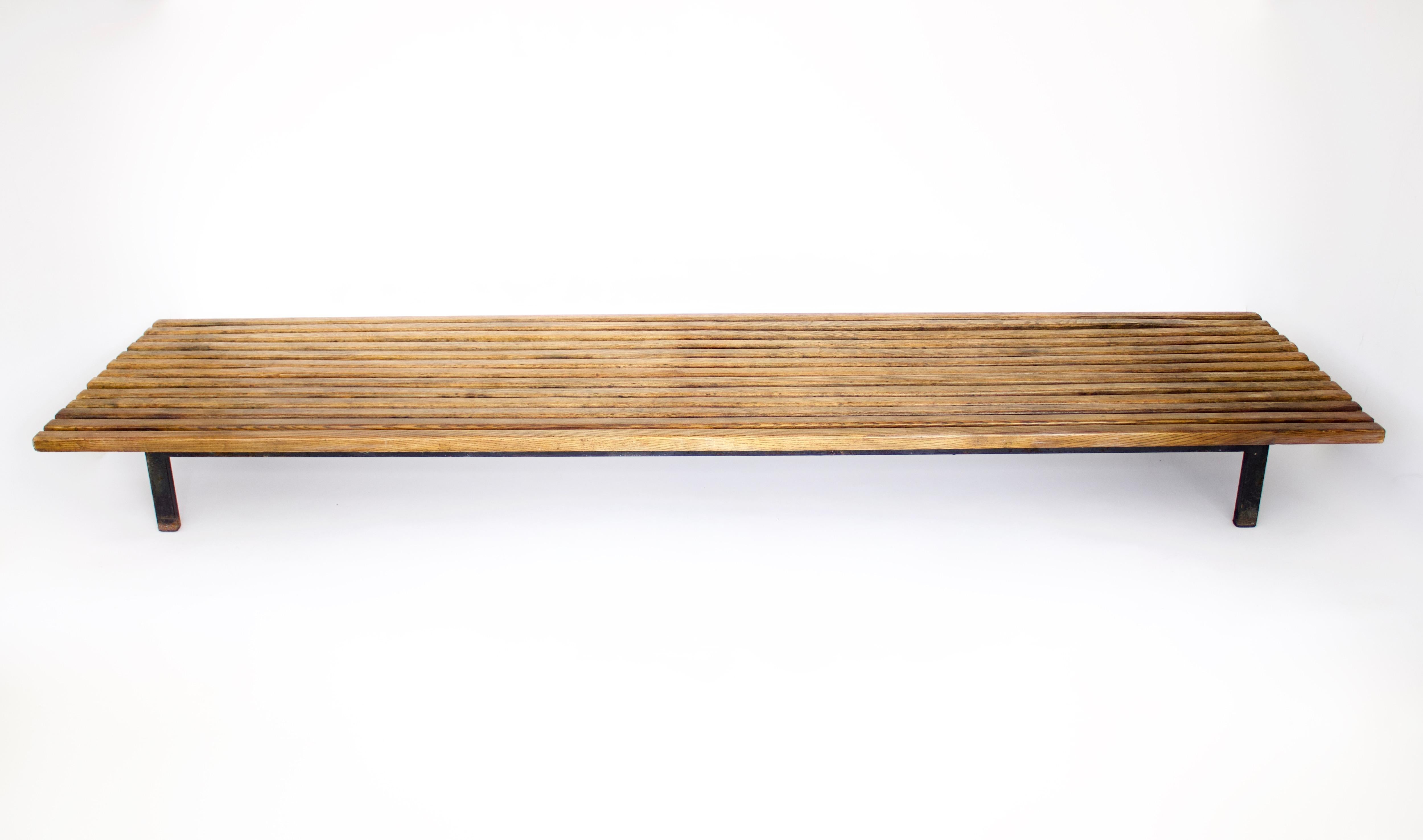 Bench designed by Charlotte Perriand, circa 1950. 
Wood, lacquered metal frame and legs. 
Provenance: Cansado, Mauritania (Africa).
In original condition, with minor wear consistent with age and use, preserving a beautiful patina. The wood has