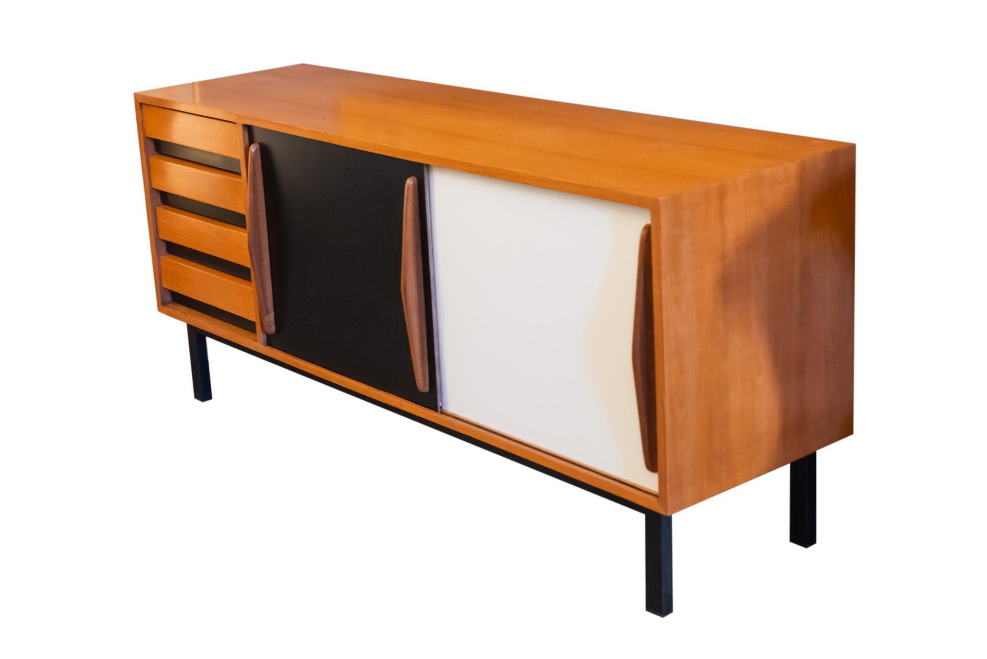Charlotte Perriand (1903-1999), Sideboard, 
Opening with two doors and four drawers,
Black and white laminated ash veneer, and lacquered metal,
Stef Simon Edition, 
circa 1958, Mining town of Cansado, Mauritania. 

Measures: Height 70 cm,