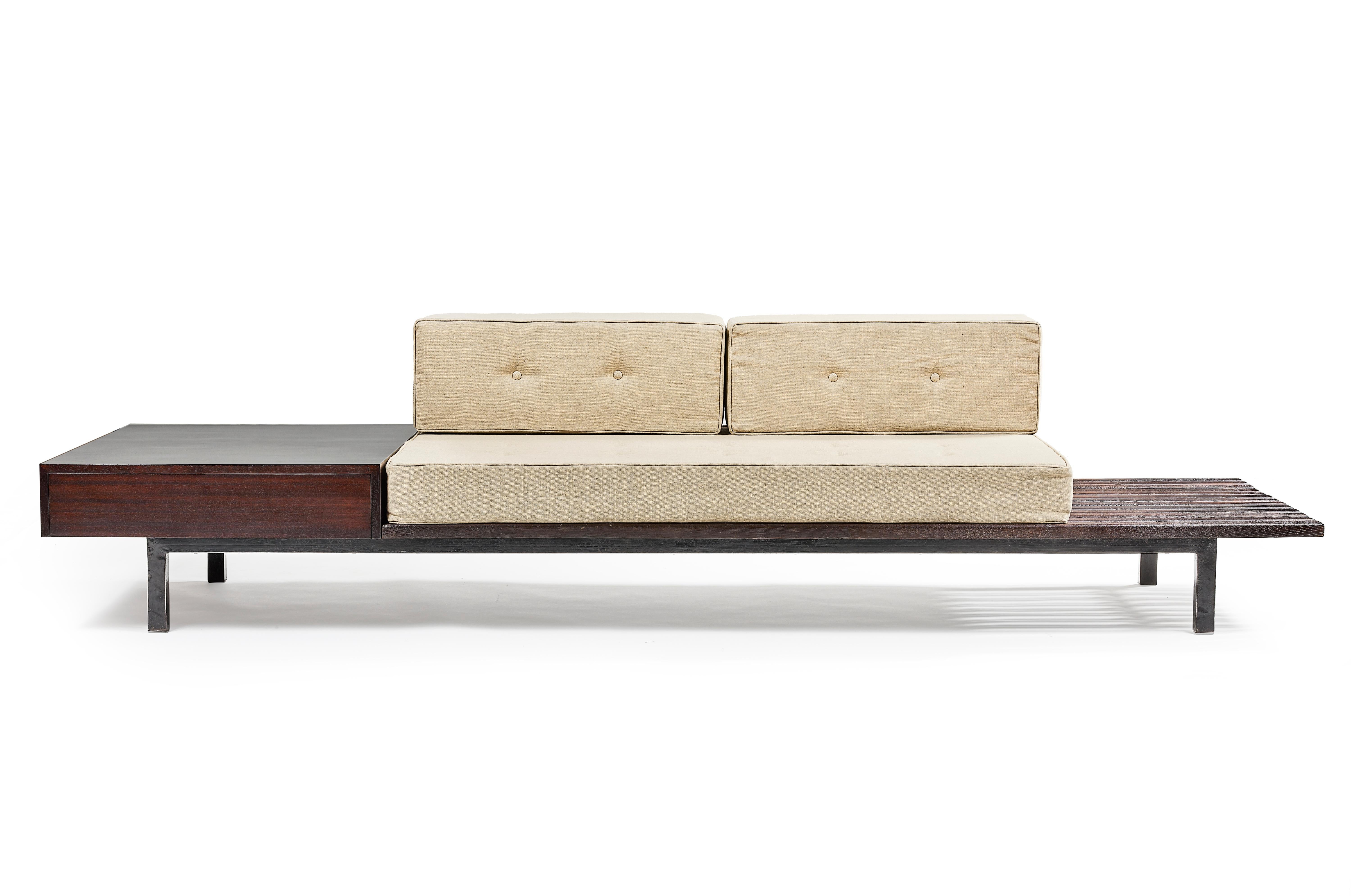 Charlotte Perriand, 1903 – 1999.
Sofa, made circa 1958 for Cansado, Mauritania, Africa.
Base in square section steel tube.
Laths are solid beech, varnished
Black Formica.
Linen cushions.
Dimension: H. 35 x L. 260 x P. 70 cm.





 