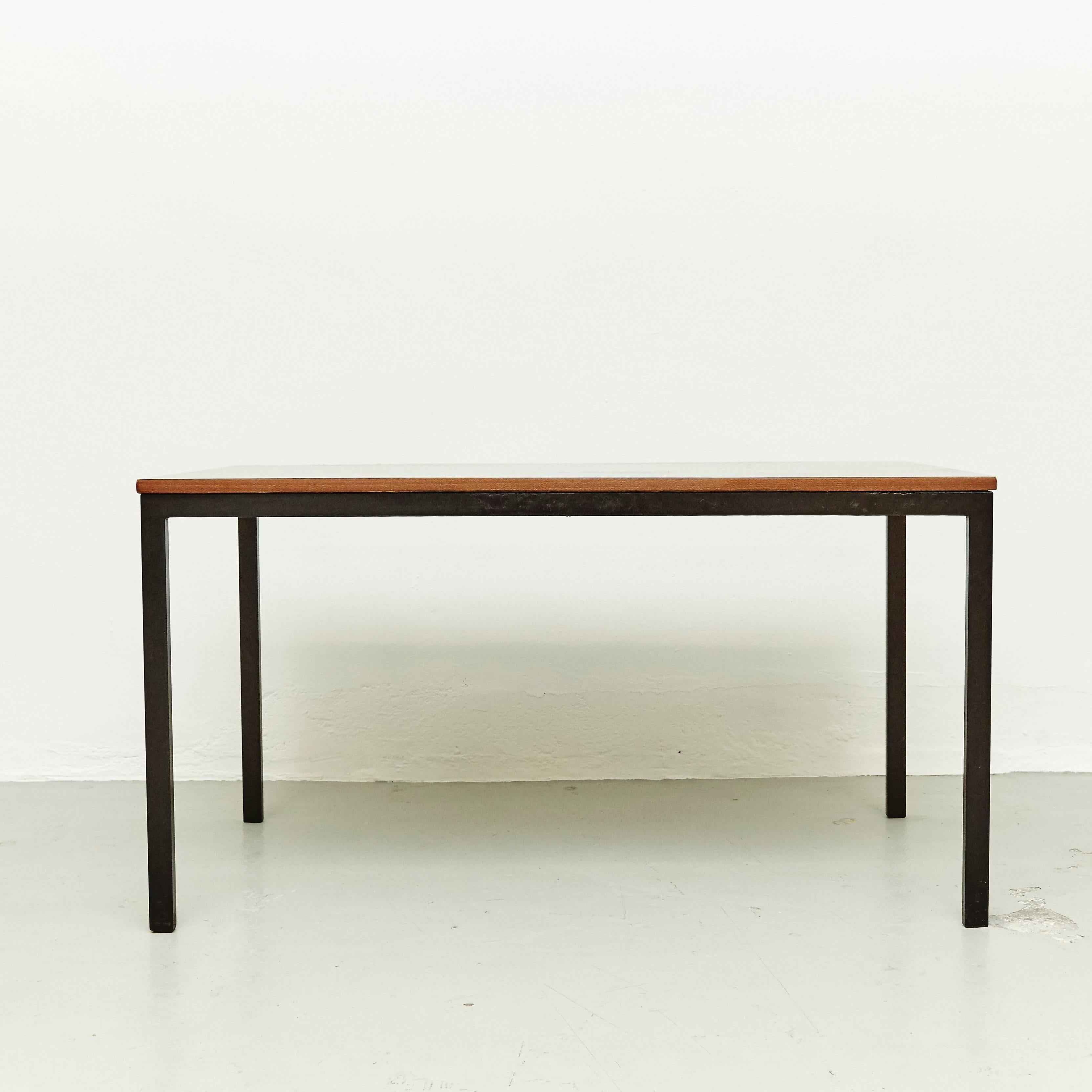 Table designed by Charlotte Perriand, circa 1950.

Wood, metal frame legs.

Provenance: Cansado, Mauritania (Africa).

In good original condition, with minor wear consistent with age and use, preserving a beautiful patina. 

Charlotte