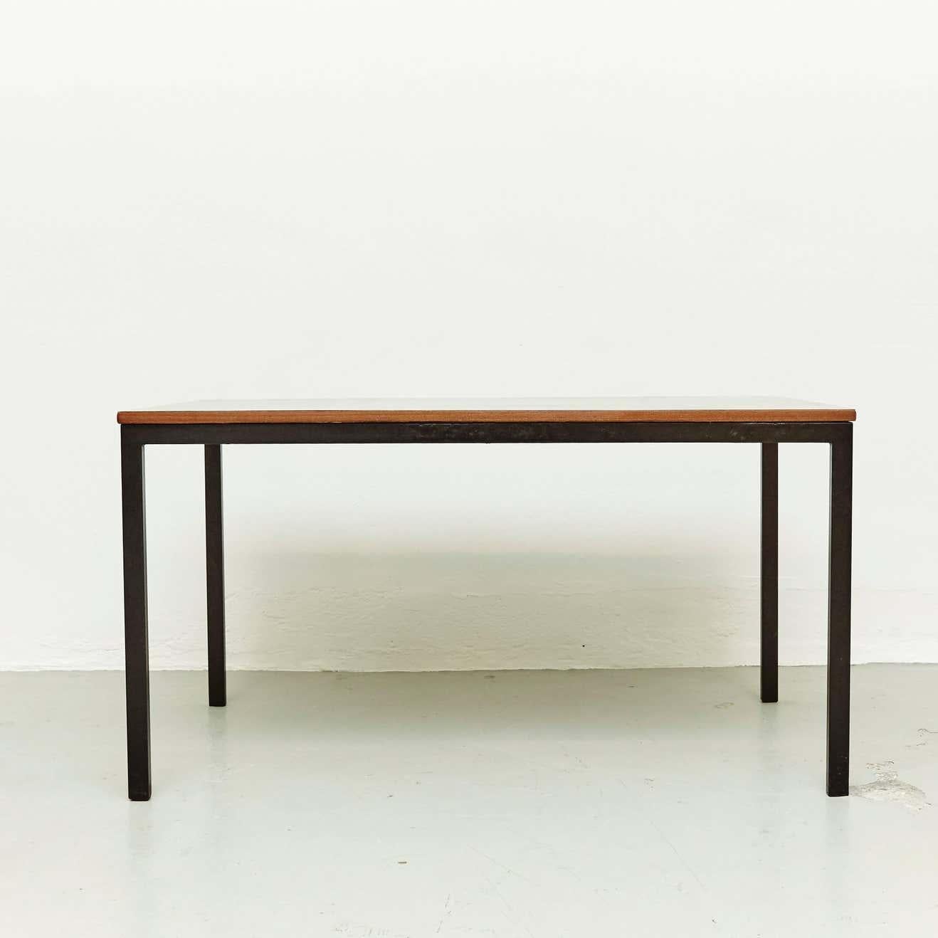 Table designed by Charlotte Perriand, circa 1950.

Wood, metal frame legs.

Provenance: Cansado, Mauritania (Africa).

In good original condition, with minor wear consistent with age and use, preserving a beautiful patina. 

Charlotte