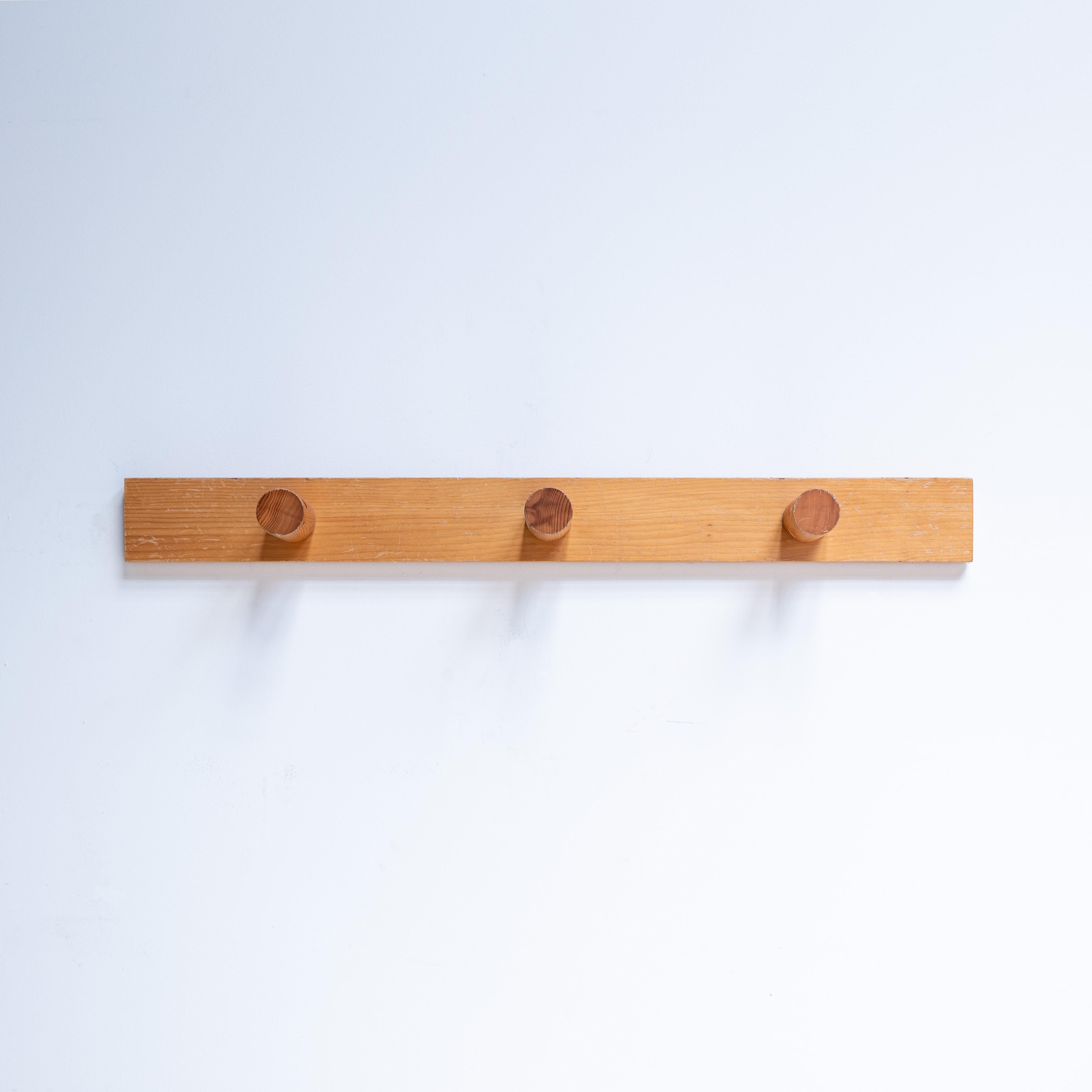 A coat rack with three hooks designed by Charlotte Perriand for Les Arcs ski resort in France. Made in 1970s. Pine solid wood. 
It's in excellent vintage condition with minor wear consistent with age and use.
Distance between the mounting points: