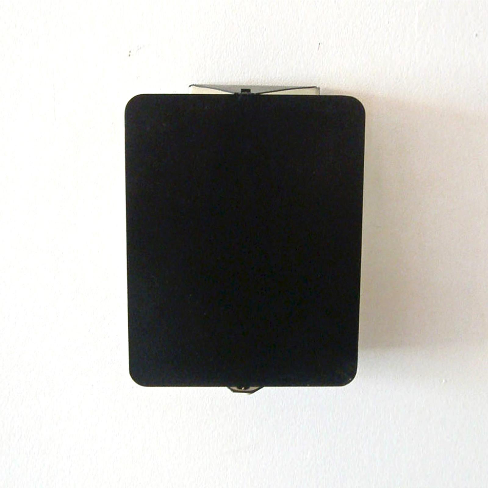 Iconic black and white enameled wall lights by Charlotte Perriand, adjustable reflectors, can be mounted horizontally or vertically, manufactured and distributed by Steph Simon, Paris, optional white, powder coated mounting plates available, to