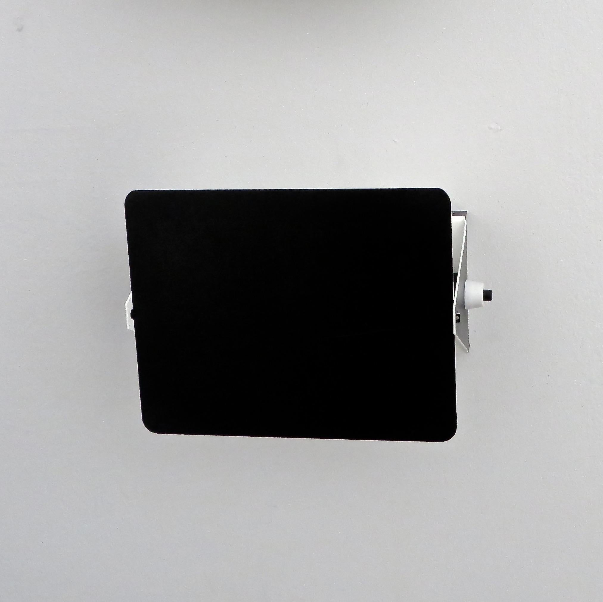 Charlotte Perriand vintage CP-1 sconces, Steph Simon edition, Paris, France.
The iconic black enamel outside with white interior and black sockets from Les Arcs ski resort. 
Original finish and sockets and switches. 
4 single sconces are available