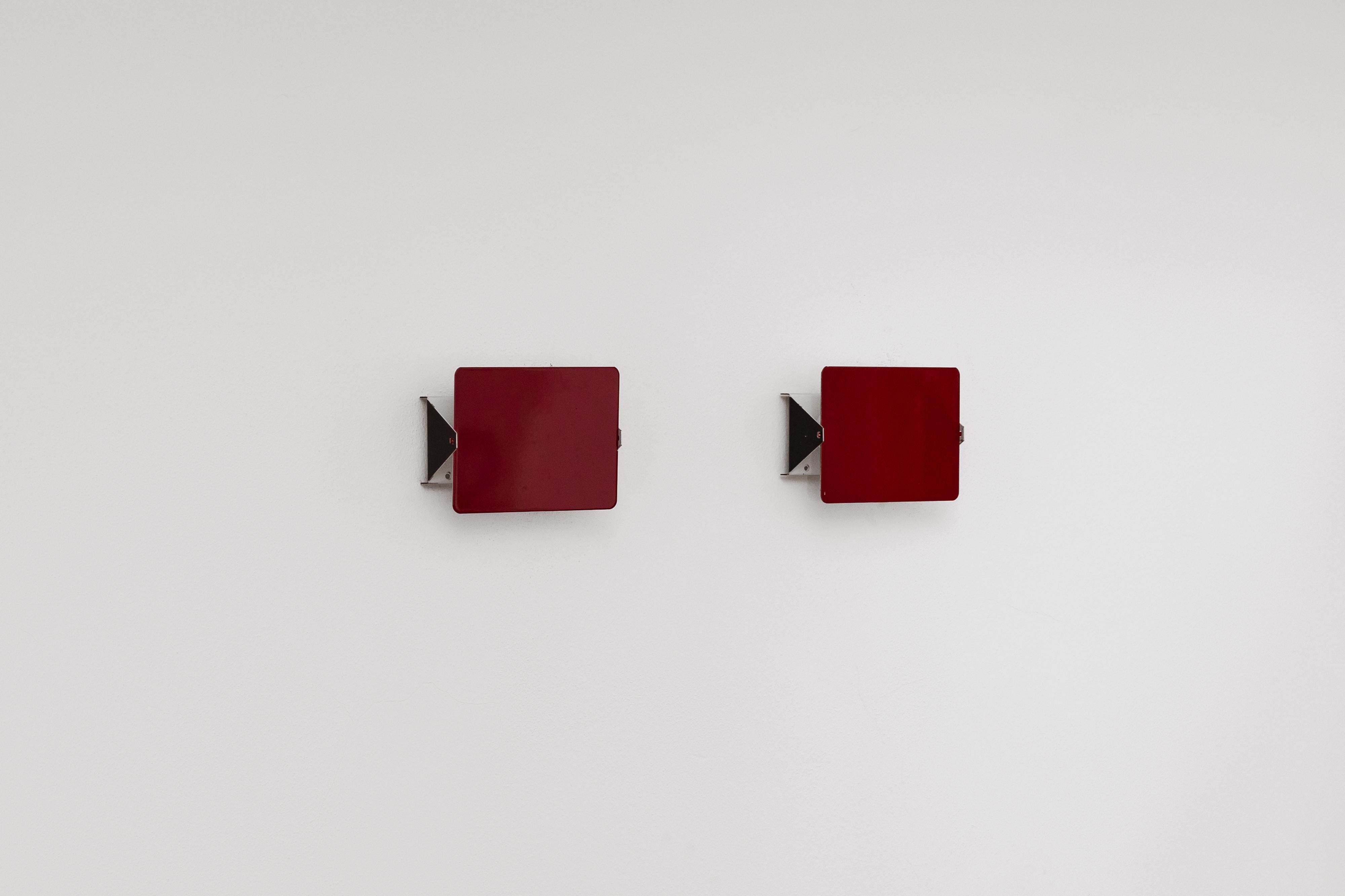 Charlotte Perriand “CP1” Sconces for Steph Simon, red steel, France, 1958, set of two

Charlotte Perriand designed the CP1 wall sconce in 1958, merging functional lighting with modular adaptability. The CP1 was conceived as a modular, space-saving