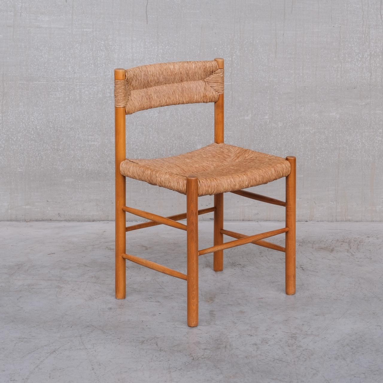 A set of four dining chairs by Charlotte Perriand. 

Rush seat rests and backs on ash frames. 

France, c1950s. 

'Dordogne' Model. 

For Sentou.

Price is for the four. We have two other sets of four incoming at the time of listing so