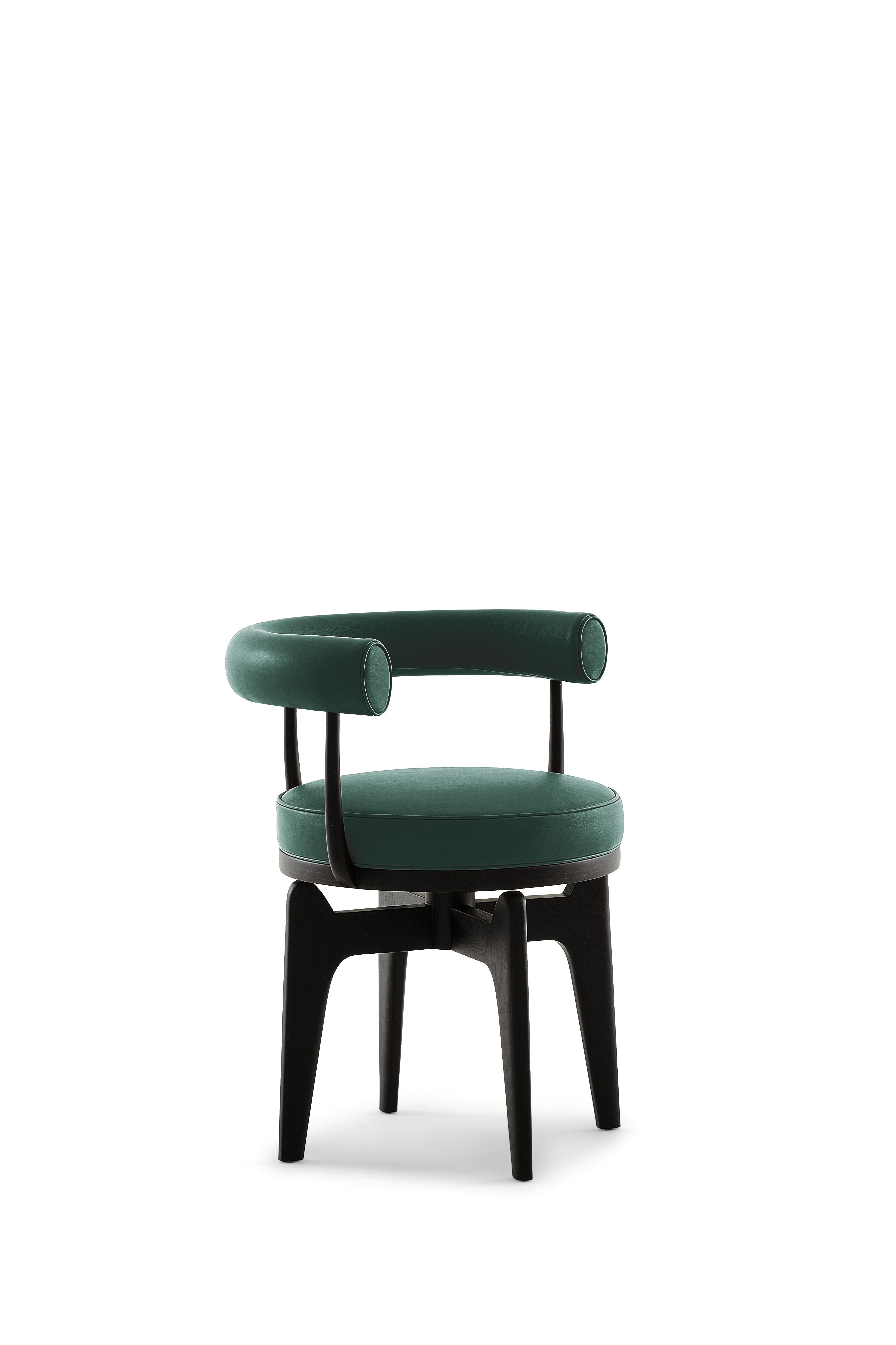 Charlotte Perriand Indochine Armchair
Manufactured by Cassina in Italy

This swivel armchair is a re-working of the LC7, whose frame was in tubular metal, and was the work of Charlotte Perriand in 1927. It was later exhibited along with other