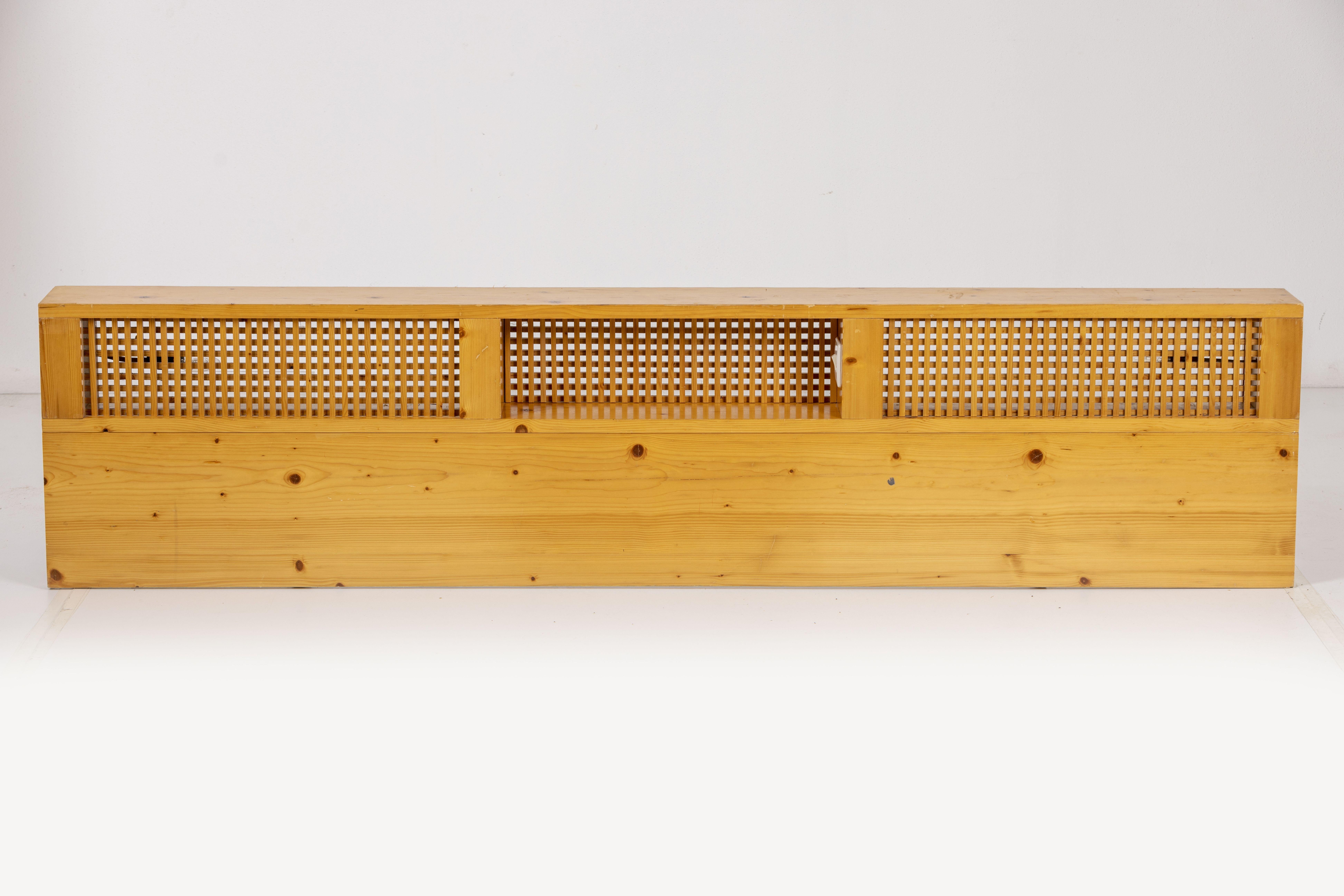 A large and rare bed headboard with integrated reading lights by Charlotte Perriand, made of pine wood with lacquered steel metal fittings. From Les Arcs 1800. Working condition.